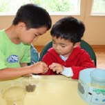 Campers count out chocolate chips for making an "edible aquifer."