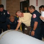 IRWD Safety Manager points out features of the chlorine canisters to Santa Ana firefighters.