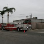 A Santa Ana fire truck is parked in front of the Primary Disinfection Facility.