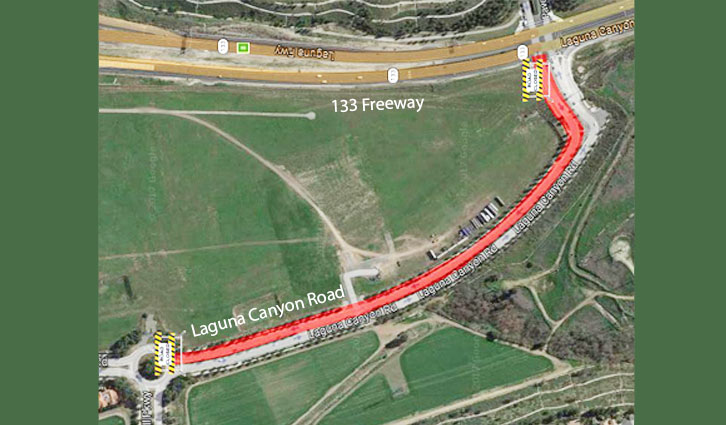 Satellite view showing a red highlighted route along Laguna Canyon Road connecting to the 133 Freeway.